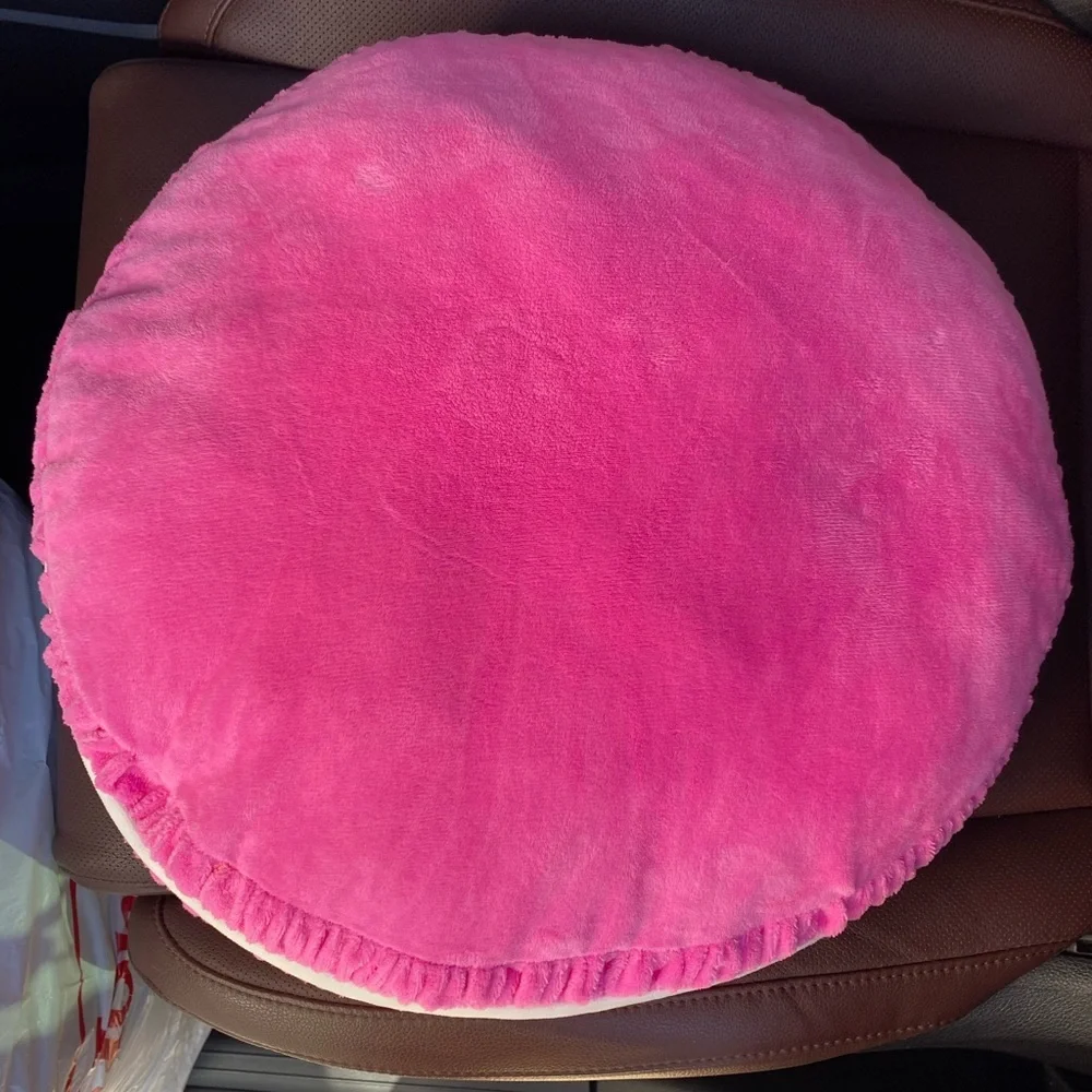 Pink micro fleece plush pink and white round accent pillow.‎